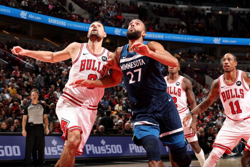 CHICAGO, IL - OCTOBER 19: Nikola Vucevic #9 of the Chicago Bulls and Rudy Gobert #27 of the Minnesota Timberwolves waits for a rebound during the game on October 19, 2023 at United Center in Chicago, Illinois. NOTE TO USER: User expressly acknowledges and agrees that, by downloading and or using this photograph, User is consenting to the terms and conditions of the Getty Images License Agreement. Mandatory Copyright Notice: Copyright 2023 NBAE (Photo by Jeff Haynes/NBAE via Getty Images)