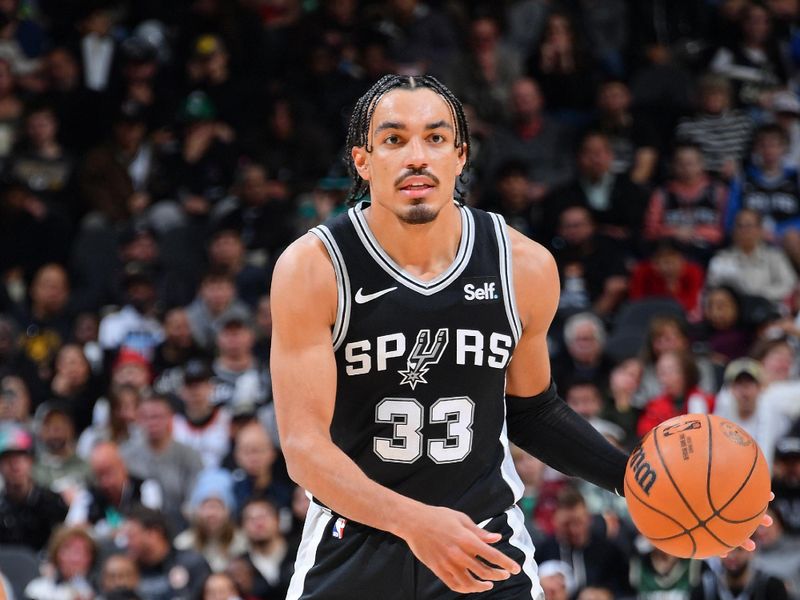 SAN ANTONIO, TX - JANUARY 4: Tre Jones #33 of the San Antonio Spurs dribbles the ball during the game against the Milwaukee Bucks on January 4, 2024 at the Frost Bank Center in San Antonio, Texas. NOTE TO USER: User expressly acknowledges and agrees that, by downloading and or using this photograph, user is consenting to the terms and conditions of the Getty Images License Agreement. Mandatory Copyright Notice: Copyright 2024 NBAE (Photos by Michael Gonzales/NBAE via Getty Images)