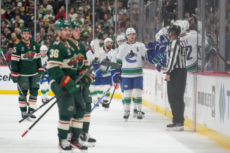 Feb 19, 2024; Saint Paul, Minnesota, USA; Vancouver Canucks center Elias Pettersson (40) celebrates a goal against the Minnesota Wild in the second period at Xcel Energy Center. Mandatory Credit: Matt Blewett-USA TODAY Sports