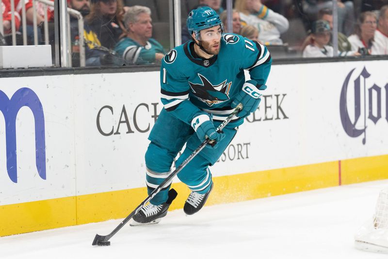 Jan 2, 2024; San Jose, California, USA; San Jose Sharks center Luke Kunin (11) controls the puck during the first period against the Detroit Red Wings at SAP Center at San Jose. Mandatory Credit: Stan Szeto-USA TODAY Sports