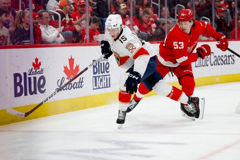 Mar 2, 2024; Detroit, Michigan, USA; Florida Panthers center Anton Lundell (15) skates with the puck chased by Detroit Red Wings defenseman Moritz Seider (53) in the third period at Little Caesars Arena. Mandatory Credit: Rick Osentoski-USA TODAY Sports