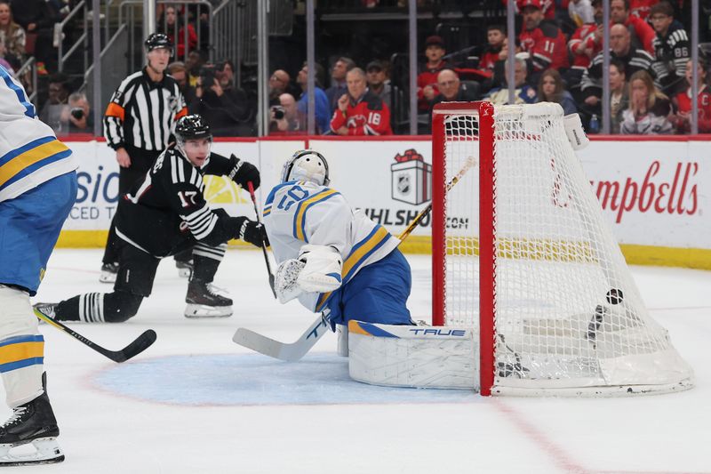Nov 26, 2025; Newark, New Jersey, USA; New Jersey Devils defenseman Simon Nemec (17) scores the game winning goal against the St. Louis Blues in overtime at Prudential Center. Mandatory Credit: Ed Mulholland-Imagn Images