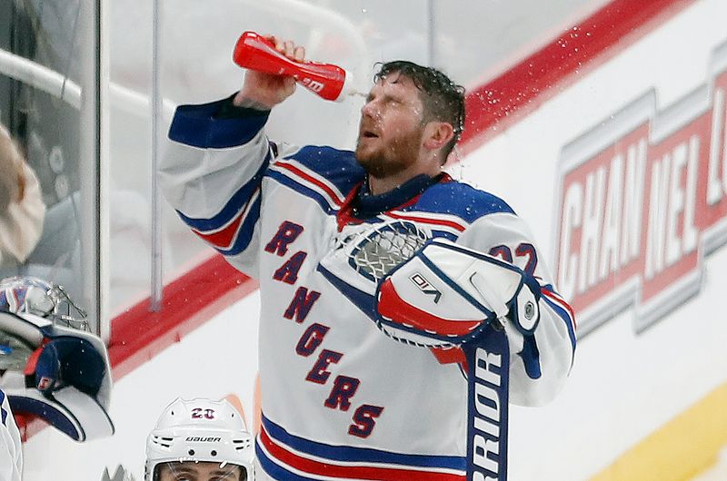 Mar 16, 2024; Pittsburgh, Pennsylvania, USA;  New York Rangers goaltender Jonathan Quick (32) sprays water on his face during a time-out against the Pittsburgh Penguins in the third period at PPG Paints Arena.  New York won 7-4. Mandatory Credit: Charles LeClaire-USA TODAY Sports
