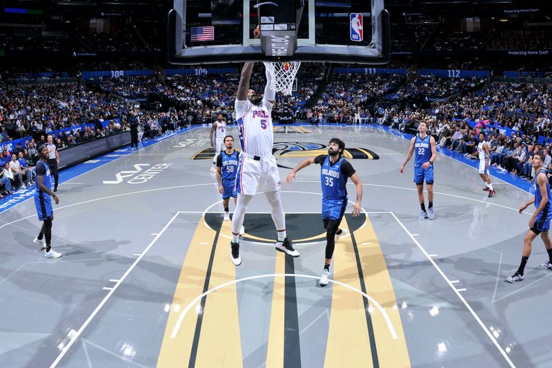 ORLANDO, FL - NOVEMBER 15: Andre Drummond #5 of the Philadelphia 76ers dunks the ball  during the game against the Orlando Magic during the Emirates NBA Cup game on  November 15, 2024 at Kia Center in Orlando, Florida. NOTE TO USER: User expressly acknowledges and agrees that, by downloading and or using this photograph, User is consenting to the terms and conditions of the Getty Images License Agreement. Mandatory Copyright Notice: Copyright 2024 NBAE (Photo by Fernando Medina/NBAE via Getty Images)