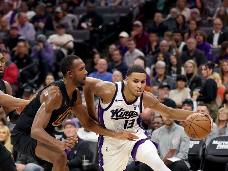 SACRAMENTO, CALIFORNIA - NOVEMBER 13: Keegan Murray #13 of the Sacramento Kings is guarded by Evan Mobley #4 of the Cleveland Cavaliers in the first half at Golden 1 Center on November 13, 2023 in Sacramento, California. NOTE TO USER: User expressly acknowledges and agrees that, by downloading and or using this photograph, User is consenting to the terms and conditions of the Getty Images License Agreement.  (Photo by Ezra Shaw/Getty Images)