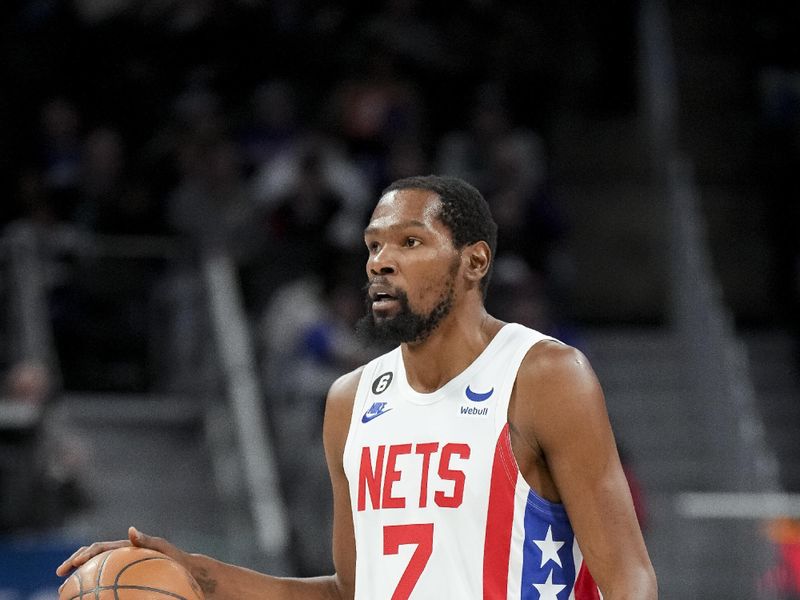 DETROIT, MICHIGAN - DECEMBER 18: Kevin Durant #7 of the Brooklyn Nets handles the ball against the Detroit Pistons at Little Caesars Arena on December 18, 2022 in Detroit, Michigan. NOTE TO USER: User expressly acknowledges and agrees that, by downloading and or using this photograph, User is consenting to the terms and conditions of the Getty Images License Agreement. (Photo by Nic Antaya/Getty Images)