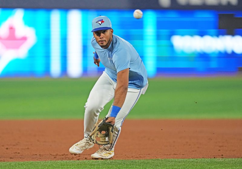 Jul 23, 2024; Toronto, Ontario, CAN; Toronto Blue Jays shortstop Leo Jimenez (49) fields a ball during batting practice before a game against the Tampa Bay Rays at Rogers Centre. Mandatory Credit: Nick Turchiaro-USA TODAY Sports