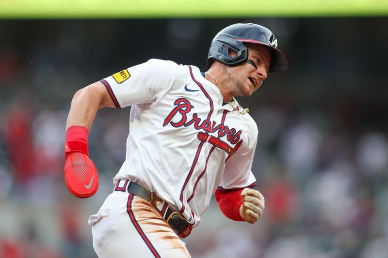 Jun 18, 2024; Atlanta, Georgia, USA; Atlanta Braves left fielder Jarred Kelenic (24) scores a run against the Detroit Tigers in the first inning at Truist Park. Mandatory Credit: Brett Davis-USA TODAY Sports
