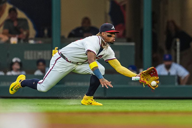 May 14, 2024; Cumberland, Georgia, USA; Atlanta Braves right fielder Ronald Acuna Jr (13) can’t hold a fly ball hit by Chicago Cubs right fielder Seiya Suzuki (27) (not pictured) during the third inning at Truist Park. Mandatory Credit: Dale Zanine-USA TODAY Sports