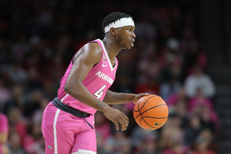 Jan 24, 2023; Fayetteville, Arkansas, USA; Arkansas Razorbacks guard Davonte Davis (4) dribbles during the first half against the LSU Tigers at Bud Walton Arena. Mandatory Credit: Nelson Chenault-USA TODAY Sports