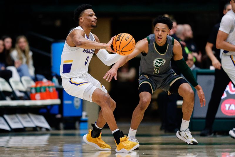 Feb 9, 2024; Fort Collins, Colorado, USA; San Jose State Spartans guard Myron Amey Jr. (0) controls the ball as Colorado State Rams guard Josiah Strong (3) guards in the second half at Moby Arena. Mandatory Credit: Isaiah J. Downing-USA TODAY Sports