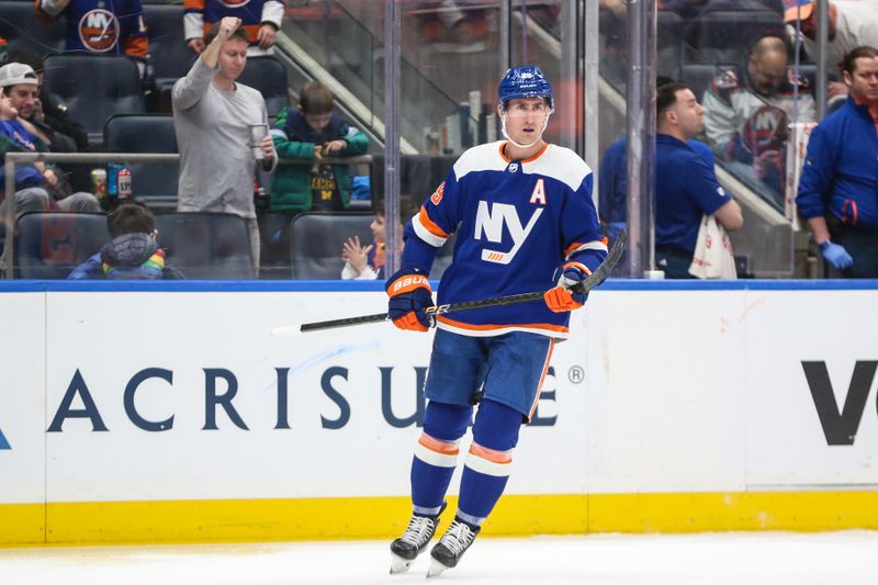 Feb 10, 2024; Elmont, New York, USA;  New York Islanders center Brock Nelson (29) skates back to center ice after scoring a goal in the third period against the Calgary Flames at UBS Arena. Mandatory Credit: Wendell Cruz-USA TODAY Sports