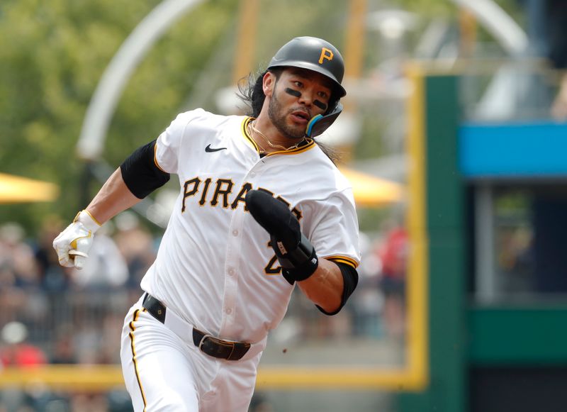 Jun 19, 2024; Pittsburgh, Pennsylvania, USA;  Pittsburgh Pirates first baseman Connor Joe (2) runs from first base to third base against the Cincinnati Reds during the second inning at PNC Park. The Pirates shutout the Reds 1-0. Mandatory Credit: Charles LeClaire-USA TODAY Sports