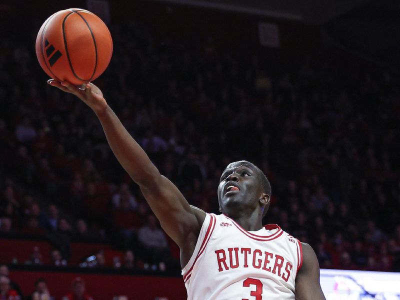 Jan 17, 2024; Piscataway, New Jersey, USA; Rutgers Scarlet Knights forward Mawot Mag (3) lays the ball up for a basket during the second half against the Nebraska Cornhuskers  at Jersey Mike's Arena. Mandatory Credit: Vincent Carchietta-USA TODAY Sports