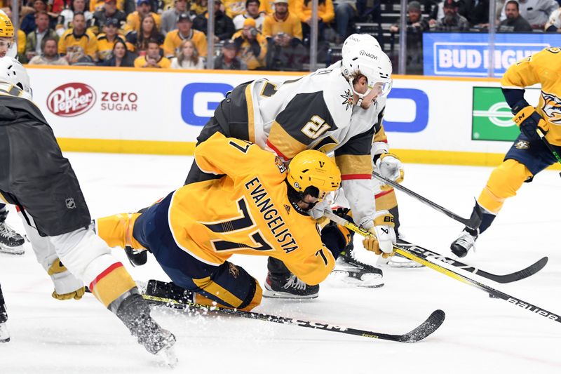 Mar 26, 2024; Nashville, Tennessee, USA; Nashville Predators right wing Luke Evangelista (77) is hit by Vegas Golden Knights center Brett Howden (21) after a shot during the first period at Bridgestone Arena. Mandatory Credit: Christopher Hanewinckel-USA TODAY Sports