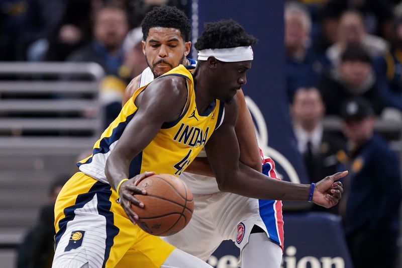INDIANAPOLIS, INDIANA - NOVEMBER 29: Pascal Siakam #43 of the Indiana Pacers dribbles the ball while being guarded by Tobias Harris #12 of the Detroit Pistons in the first quarter of the Emirates NBA Cup game at Gainbridge Fieldhouse on November 29, 2024 in Indianapolis, Indiana. NOTE TO USER: User expressly acknowledges and agrees that, by downloading and or using this photograph, User is consenting to the terms and conditions of the Getty Images License Agreement. (Photo by Dylan Buell/Getty Images)