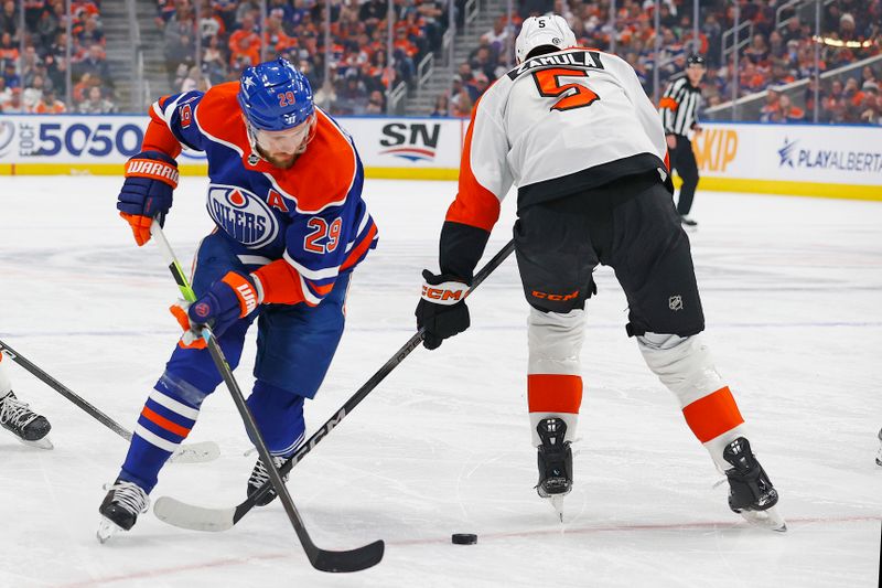 Jan 2, 2024; Edmonton, Alberta, CAN; Edmonton Oilers 29/ carries the puck around Philadelphia Flyers defensemen Egor Zamula (5) during the first period at Rogers Place. Mandatory Credit: Perry Nelson-USA TODAY Sports