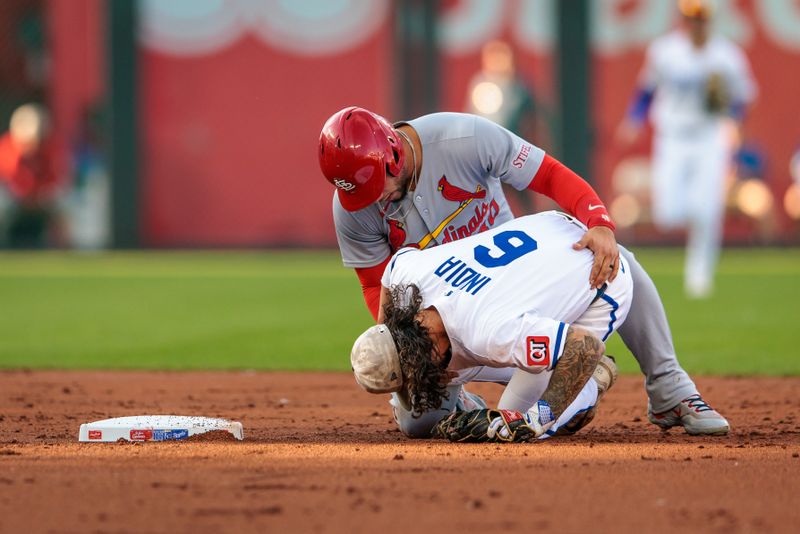 May 17, 2025; Kansas City, Missouri, USA; St. Louis Cardinals first base Willson Contreras (40) attends to Kansas City Royals third base Jonathan India (6) after hitting him in the knee sliding into second base during the second inning at Kauffman Stadium. Mandatory Credit: William Purnell-Imagn Images