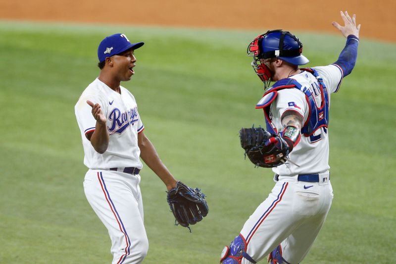 Oct 10, 2023; Arlington, Texas, USA; Texas Rangers relief pitcher Jose Leclerc (25) and catcher Jonah Heim (28) celebrate after defeating the Baltimore Orioles in game three of the ALDS for the 2023 MLB playoffs at Globe Life Field. Mandatory Credit: Andrew Dieb-USA TODAY Sports