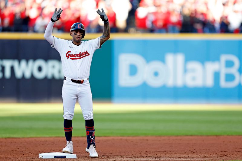 Oct 7, 2024; Cleveland, Ohio, USA; Cleveland Guardians shortstop Brayan Rocchio (4) celebrates after hitting a double during the sixth inning against the Detroit Tigers during game two of the ALDS for the 2024 MLB Playoffs at Progressive Field. Mandatory Credit: Scott Glavin-Imagn Images