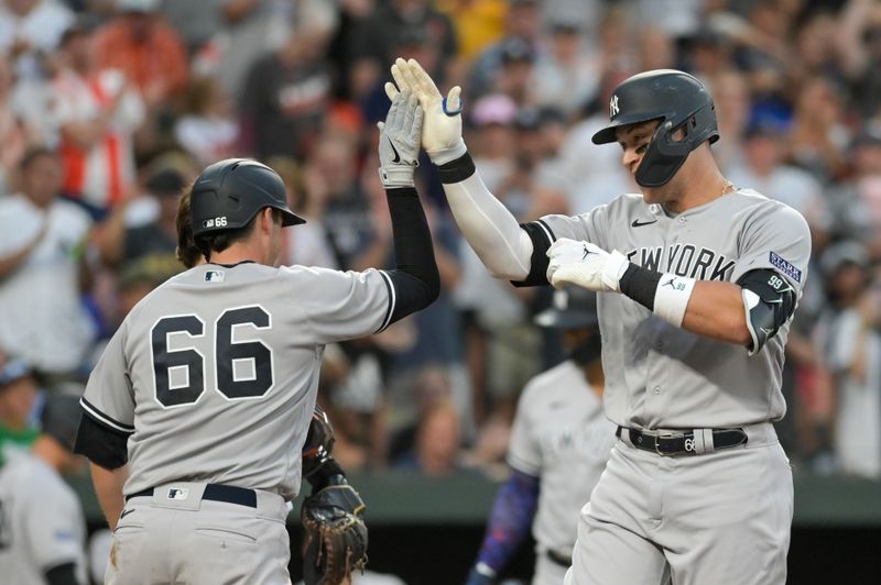 Jul 29, 2023; Baltimore, Maryland, USA;  New York Yankees right fielder Aaron Judge (99) celebrates with catcher Kyle Higashioka (66) at home plate after hitting a two run home run in the third inning against the Baltimore Orioles at Oriole Park at Camden Yards. Mandatory Credit: Tommy Gilligan-USA TODAY Sports