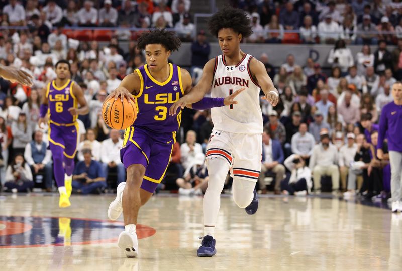 Jan 13, 2024; Auburn, Alabama, USA;  LSU Tigers guard Jalen Cook (3) is pressured by Auburn Tigers guard Aden Holloway (1) during the first half at Neville Arena. Mandatory Credit: John Reed-USA TODAY Sports