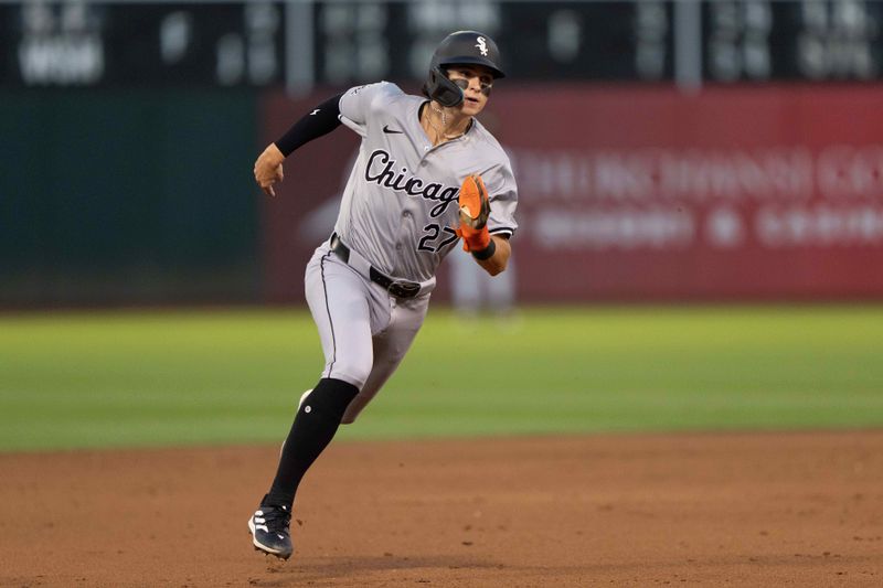 Aug 6, 2024; Oakland, California, USA;  Chicago White Sox shortstop Brooks Baldwin (27) runs towards third base during the sixth inning against the Oakland Athletics at Oakland-Alameda County Coliseum. Mandatory Credit: Stan Szeto-USA TODAY Sports