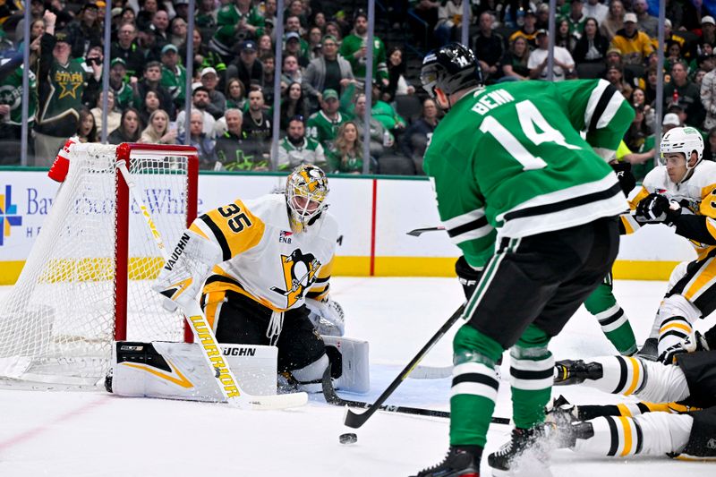 Mar 22, 2024; Dallas, Texas, USA; Dallas Stars left wing Jamie Benn (14) scores a goal against Pittsburgh Penguins goaltender Tristan Jarry (35) during the second period at the American Airlines Center. Mandatory Credit: Jerome Miron-USA TODAY Sports