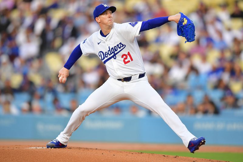 May 31, 2024; Los Angeles, California, USA; Los Angeles Dodgers pitcher Walker Buehler (21) throws against the Colorado Rockies during the first inning at Dodger Stadium. Mandatory Credit: Gary A. Vasquez-USA TODAY Sports