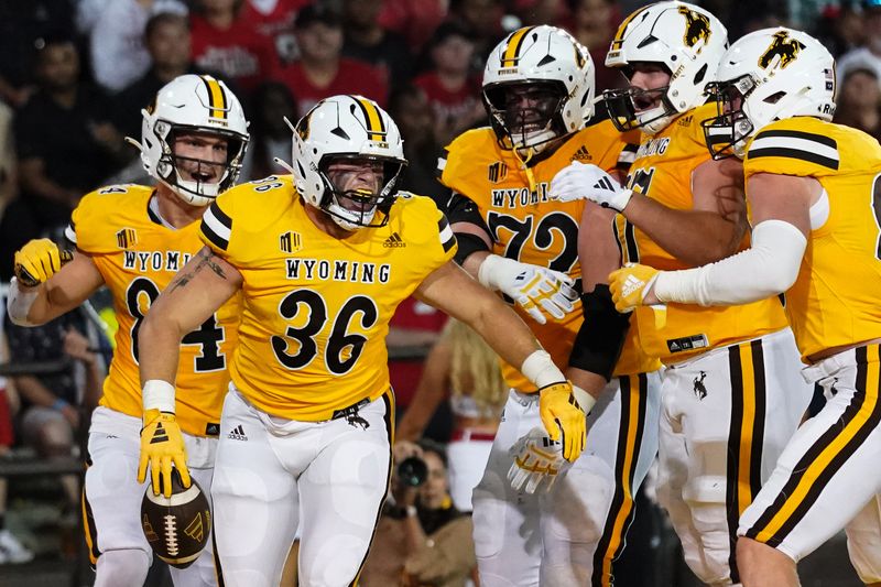 Sep 2, 2023; Laramie, Wyoming, USA; Wyoming Cowboys fullback Caleb Driskill (36) reacts after scoring a touchdown against the Texas Tech Red Raiders during the second quarter at Jonah Field at War Memorial Stadium. Mandatory Credit: Troy Babbitt-USA TODAY Sports