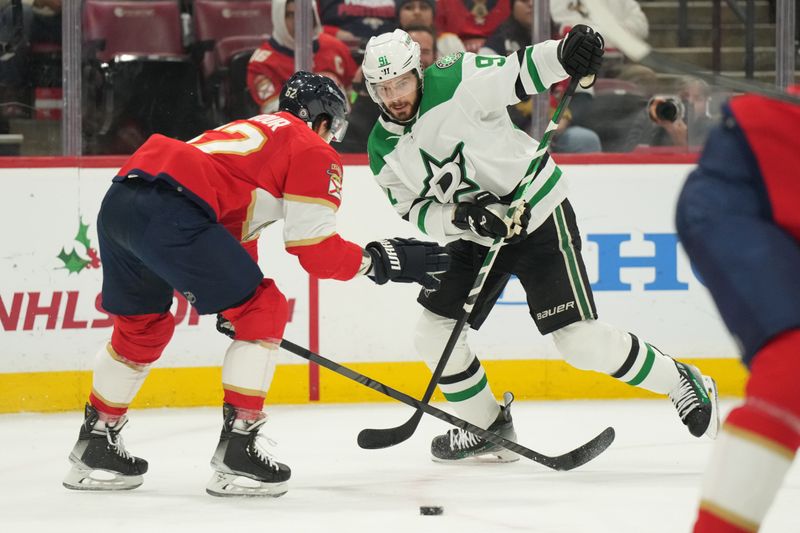 Dec 6, 2023; Sunrise, Florida, USA; Dallas Stars center Tyler Seguin (91) makes a pass as Florida Panthers defenseman Brandon Montour (62) closes in during the first period at Amerant Bank Arena. Mandatory Credit: Jim Rassol-USA TODAY Sports