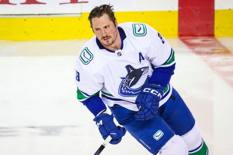 Dec 2, 2023; Calgary, Alberta, CAN; Vancouver Canucks center J.T. Miller (9) skates during the warmup period against the Calgary Flames at Scotiabank Saddledome. Mandatory Credit: Sergei Belski-USA TODAY Sports