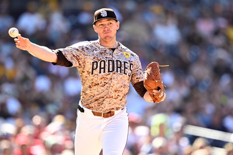 Apr 28, 2024; San Diego, California, USA; San Diego Padres relief pitcher Stephen Kolek (32) throws to first base on a ground out by Philadelphia Phillies catcher J.T. Realmuto (not pictured) during the ninth inning at Petco Park. Mandatory Credit: Orlando Ramirez-USA TODAY Sports