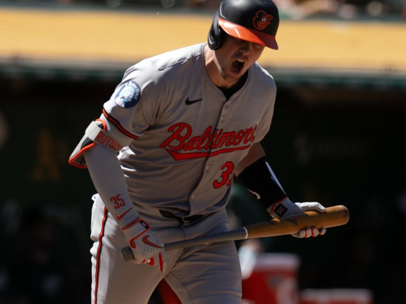 Jul 7, 2024; Oakland, California, USA; Baltimore Orioles catcher Adley Rutschman (35) reacts to popping out against the Oakland Athletics during the ninth inning at Oakland-Alameda County Coliseum. Mandatory Credit: D. Ross Cameron-USA TODAY Sports