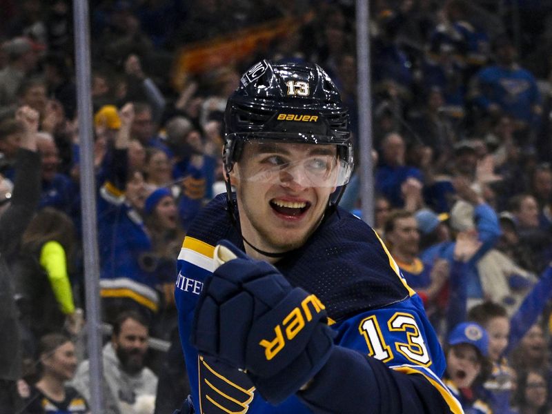 Mar 19, 2024; St. Louis, Missouri, USA;  St. Louis Blues right wing Alexey Toropchenko (13) reacts after scoring against the Colorado Avalanche during the second period at Enterprise Center. Mandatory Credit: Jeff Curry-USA TODAY Sports