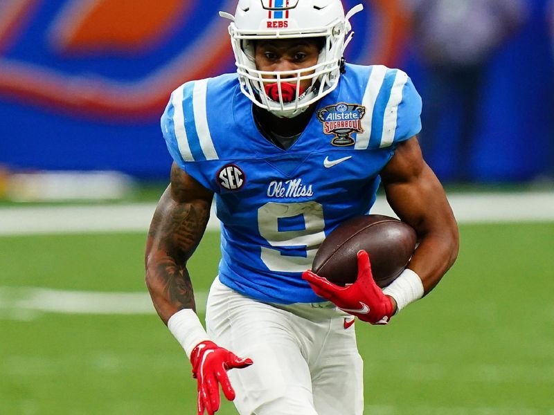 Jan 1, 2022; New Orleans, LA, USA; Mississippi Rebels running back Jerrion Ealy (9) runs with the ball against the Baylor Bears during the first half in the 2022 Sugar Bowl at Caesars Superdome. Mandatory Credit: John David Mercer-USA TODAY Sports