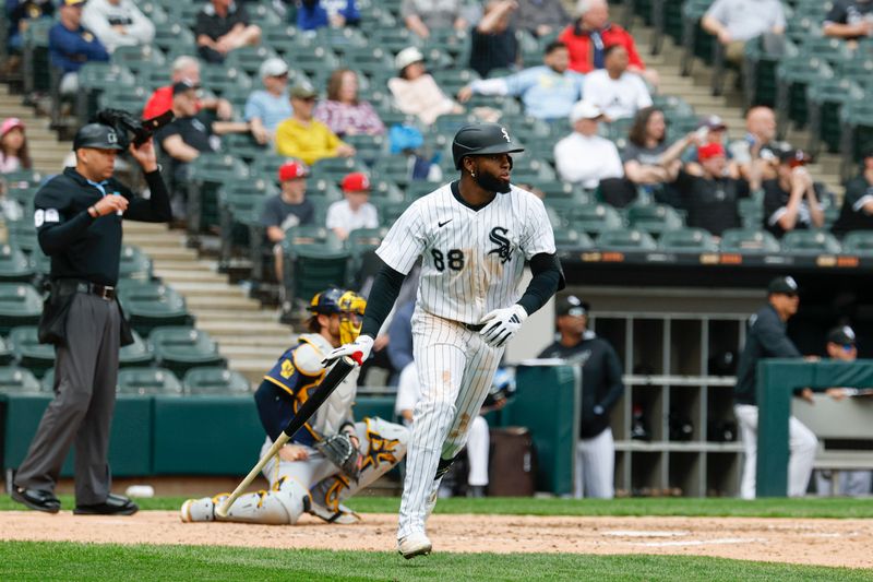 May 1, 2025; Chicago, Illinois, USA; Chicago White Sox center fielder Luis Robert Jr. (88) watches his three-run double against the Milwaukee Brewers during the seventh inning at Rate Field. Mandatory Credit: Kamil Krzaczynski-Imagn Images