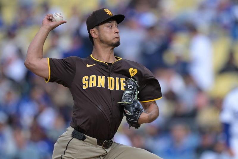 Apr 14, 2024; Los Angeles, California, USA; San Diego Padres pitcher Yu Darvish (11) throws to the plate in the second inning against the Los Angeles Dodgers at Dodger Stadium. Mandatory Credit: Jayne Kamin-Oncea-USA TODAY Sports