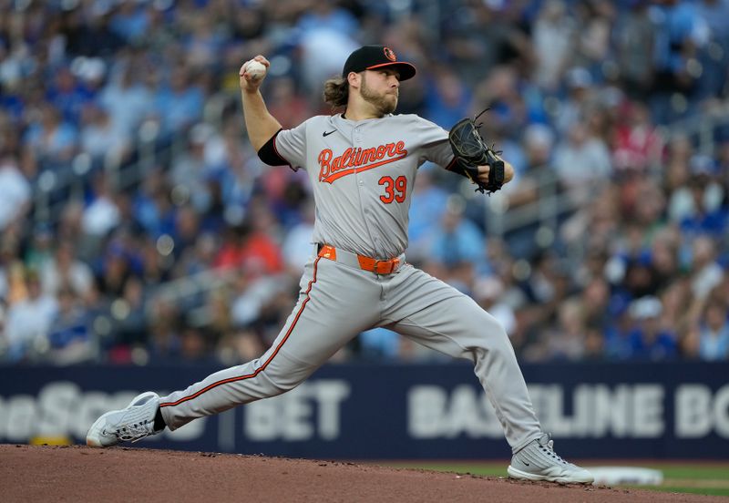 Jun 4, 2024; Toronto, Ontario, CAN; Baltimore Orioles starting pitcher Corbin Burnes (39) pitches to the Toronto Blue Jays during the first inning at Rogers Centre. Mandatory Credit: John E. Sokolowski-USA TODAY Sports