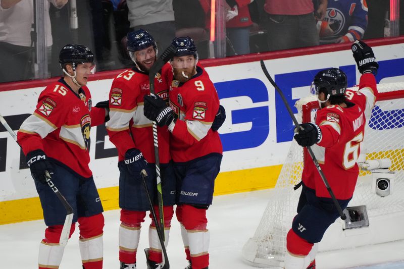 Jun 24, 2024; Sunrise, Florida, USA; Florida Panthers forward Carter Verhaeghe (23) celebrates scoring with forward Anton Lundell (15) and forward Sam Bennett (9) and defenseman Brandon Montour (62) against Edmonton Oilers goaltender Skinner Stuart (74) during the first period in game seven of the 2024 Stanley Cup Final at Amerant Bank Arena. Mandatory Credit: Jim Rassol-USA TODAY Sports
