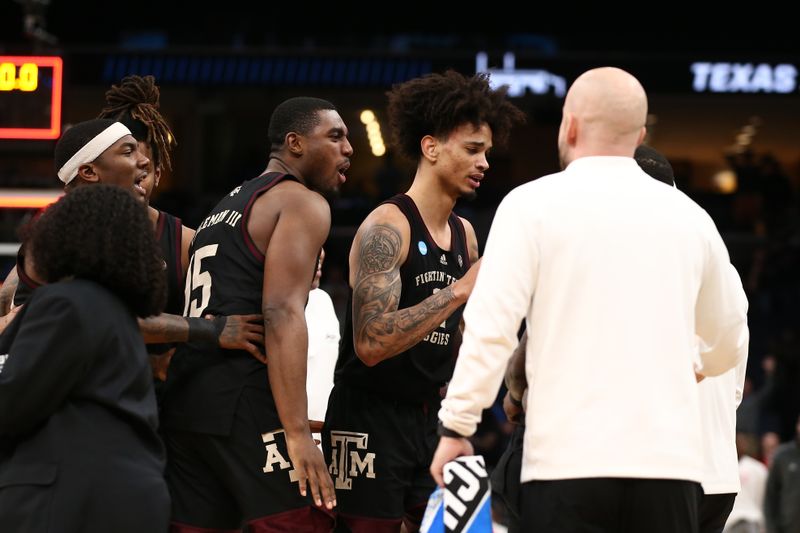 Mar 24, 2024; Memphis, TN, USA; Texas A&M Aggies forward Henry Coleman III (15) celebrates with Texas A&M Aggies forward Andersson Garcia (11) after scoring a game tying point to go to overtime in the second round of the 2024 NCAA Tournament at FedExForum. Mandatory Credit: Petre Thomas-USA TODAY Sports
