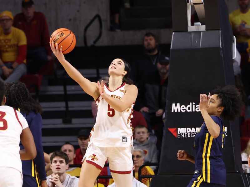 Jan 11, 2026; Ames, Iowa, USA; Iowa State Cyclones guard Evangelia Paulk (5) shoots against the West Virginia Mountaineers during the second half at James H. Hilton Coliseum. Mandatory Credit: Reese Strickland-Imagn Images