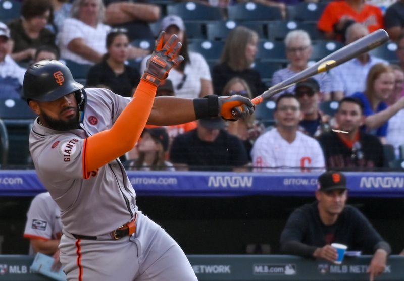 Jul 20, 2024; Denver, Colorado, USA; San Francisco Giants outfielder Heliot Ramos (17) breaks his bat in the first inning against the Colorado Rockies at Coors Field. Mandatory Credit: John Leyba-USA TODAY Sports