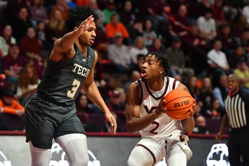 Jan 27, 2024; Blacksburg, Virginia, USA; Virginia Tech Hokies guard MJ Collins (2)  looks to pass the ball while being defended by Georgia Tech Yellow Jackets guard Dallan Coleman (3) during the second half at Cassell Coliseum. Mandatory Credit: Brian Bishop-USA TODAY Sports