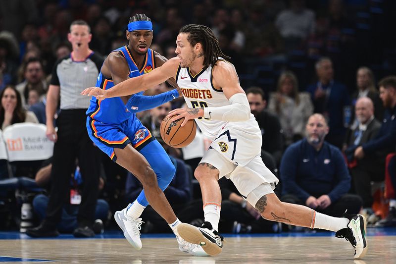 OKLAHOMA CITY, OKLAHOMA - JANUARY 31: Aaron Gordon #50 of the Denver Nuggets drives against Shai Gilgeous-Alexander #2 of the Oklahoma City Thunder during the first half at Paycom Center on January 31, 2024 in Oklahoma City, Oklahoma. NOTE TO USER: User expressly acknowledges and agrees that, by downloading and or using this Photograph, user is consenting to the terms and conditions of the Getty Images License Agreement. (Photo by Joshua Gateley/Getty Images)