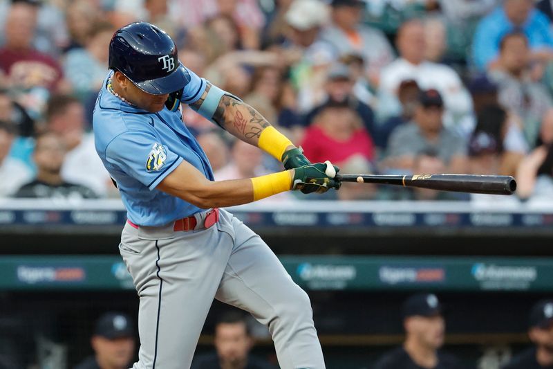 Aug 4, 2023; Detroit, Michigan, USA;  Tampa Bay Rays center fielder Jose Siri (22) hits an RBI single in the sixth inning against the Detroit Tigers at Comerica Park. Mandatory Credit: Rick Osentoski-USA TODAY Sports