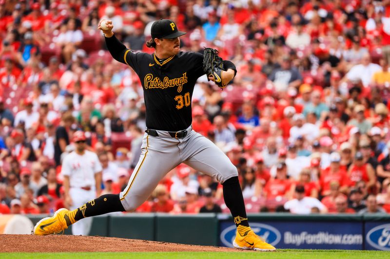 Sep 22, 2024; Cincinnati, Ohio, USA; Pittsburgh Pirates starting pitcher Paul Skenes (30) pitches against the Cincinnati Reds in the first inning at Great American Ball Park. Mandatory Credit: Katie Stratman-Imagn Images