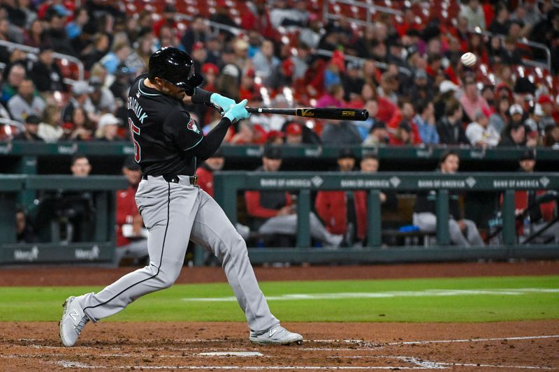 Apr 23, 2024; St. Louis, Missouri, USA;  Arizona Diamondbacks right fielder Randal Grichuk (15) hits a one run single against the St. Louis Cardinals during the fifth inning at Busch Stadium. Mandatory Credit: Jeff Curry-USA TODAY Sports