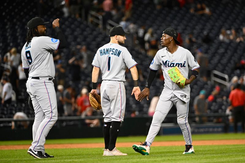 Aug 31, 2023; Washington, District of Columbia, USA; Miami Marlins center fielder Jazz Chisholm Jr. (2) celebrates with Miami Marlins center fielder Garrett Hampson (1) after the game against the Washington Nationals  at Nationals Park. Mandatory Credit: Brad Mills-USA TODAY Sports