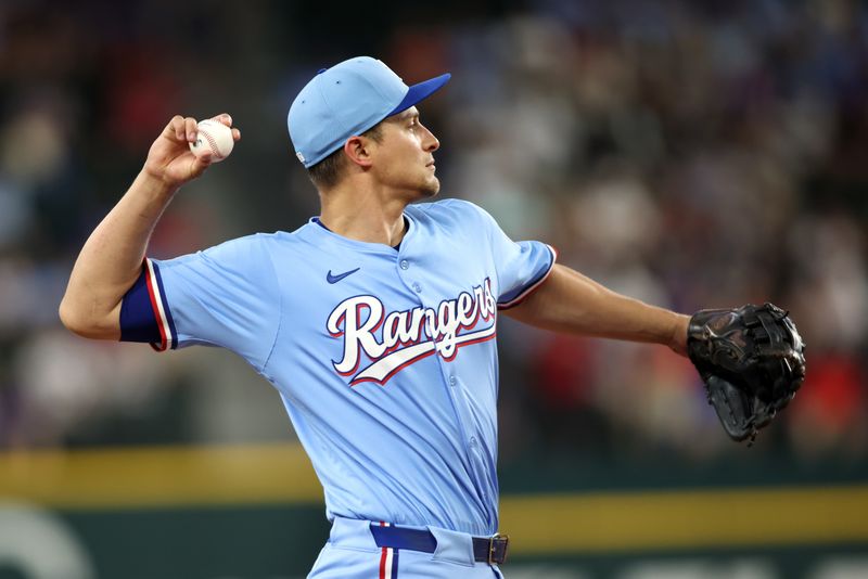 Jun 29, 2025; Arlington, Texas, USA; Texas Rangers shortstop Corey Seager (5) throws a ball to first base during warmups before the game against the Seattle Mariners at Globe Life Field. Mandatory Credit: Tim Heitman-Imagn Images